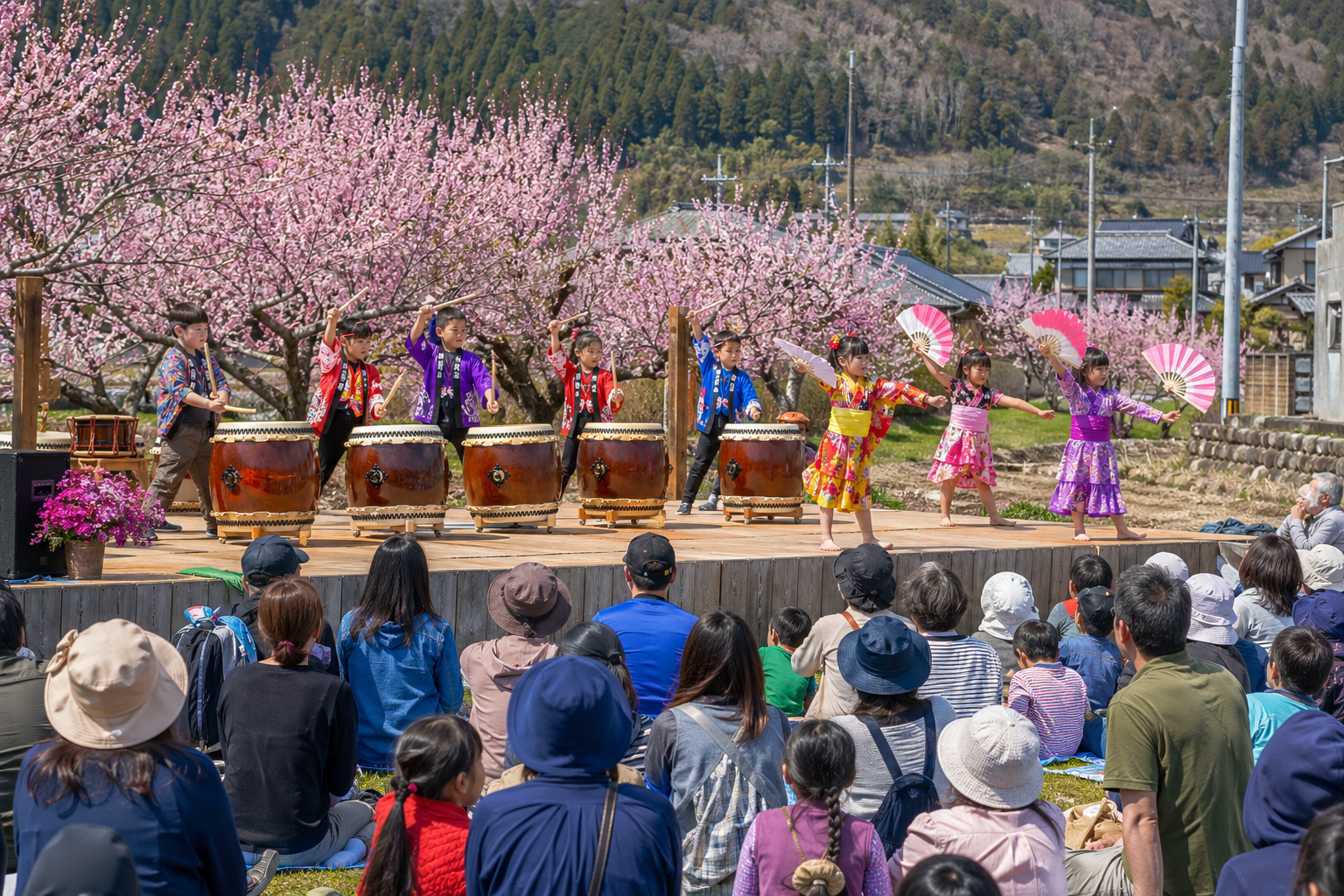 地域まつりのステージで子どもたちが演目を披露するイメージ。田尻杏まつりの特定の公演を再現したものではありません。※AIにより生成した参考イメージです。